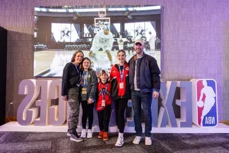 A family of basketball fans attends the NBA All-Star Game festivities.